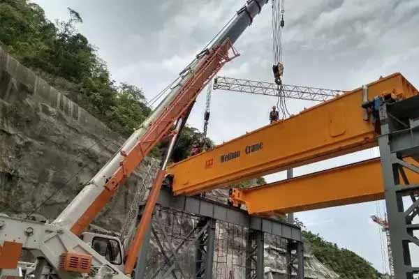 A 300t hydropower bridge crane powered by Weihua had delivered to Honduras. It is made for China Construction Group International Project for Honduras Patuka Ⅲ hydropower station construction. This bridge crane is mainly for the lifting of the hydropower generators and turbines.  The project is the first large-scale hydropower project in Honduras in the past 30 years. This bridge crane is designed with low headroom, lightweight, small wheel pressure, and there is safety brakes at reel drum tail. At present, the crane has been carried out installation and commissioning. Now it is preparing for the load test and acceptance work..jpg